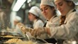 © ngstock - See students in a high school cooking class learning new recipes and culinary techniques