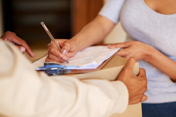 Canvas Print - Woman, hands and signing for parcel with delivery man, clipboard and courier receipt or receiving package. Customer, document and distribution service with logistics worker, ecommerce or online order