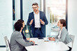 © peopleimages.com - Businessman, meeting and discussion with team in office for planning, brainstorming and ideas on project deal for client. Group, man and staff with support for teamwork of work performance progress