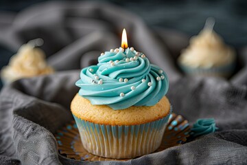 Wall Mural - Birthday cupcake with lit candle