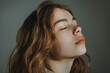 © MagnusCort - A close up of a woman's face with her eyes closed looking to a side