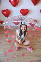 Sticker - menina pré adolescente sorridente estilosa em decoração chuva de amor com corações vermelhos 