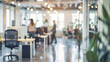 © Lull - Blurred modern office space. A blurred image of a modern office space with people working, ideal for websites and presentations related to business, work, or technology.