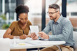 © peopleimages.com - Businesspeople, woman and man on tablet with writing in office for communication or social media. Diversity, coworkers and technology in meeting for information, internet or online as project manager