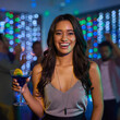 © peopleimages.com - Clubbing, drink and portrait of woman at party for celebration, disco or nightlife event. Alcohol, cocktail in glass and face with happy person drinking at nightclub for dance, rave or social