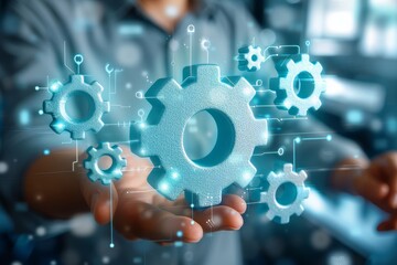 Leinwandbilder - Hand touching a digital interface with interconnected gears, symbolizing the intricate and innovative technology involved in modern digital systems and engineering mechanisms