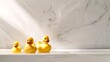 © Irina Ukrainets - Rubber ducks in a row on a marble ledge. Clean, playful vibe. Perfect for bath time articles. Serene bathroom decor. AI