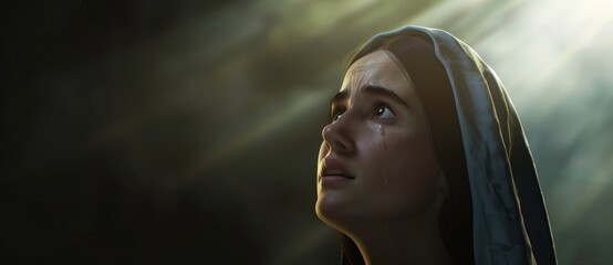 Wall Mural - Biblical character.     Emotional close up portrait of a woman with blue eyes in a veil looking up. Looking up to heaven with tears in her eyes, full-length shot set in biblical times,