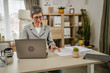 © Miljan Živković - One mature caucasian businesswoman work on laptop at office