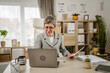 © Miljan Živković - One mature caucasian businesswoman work on laptop at office