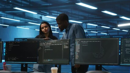Poster - multiethnic team of engineers uses laptop to do programming for servers providing computing resource