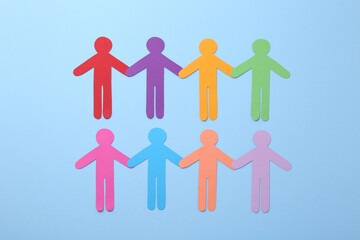 Wall Mural - Equality concept. Different human figures on light blue background, flat lay