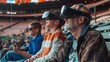 © Justlight - A father and son sit in the stands of a baseball game both wearing AR headsets that give them an immersive and informative viewing experience.