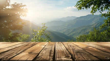 Wooden table top with blurred green mountain landscape background, nature concept for product display montage.