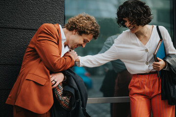 Sticker - Two colleagues having a fun, casual interaction outside an office building, showcasing a friendly and relaxed atmosphere at work.