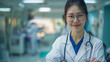 © Humans - Smiling Asian female doctor