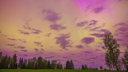 Wall Mural - Purple-Hued Sky With Clouds Rolling Over Rural Nature At Sunset. Timelapse