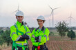 © eakgrungenerd - portrait of engineer man and woman wearing safety uniform. Renewable energy at station energy power wind. technology protect environment reduce global warming problems.