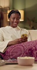 Poster - Night, home and black woman with smartphone on sofa for chat, online communication and social media. House, living room and couch for girl with mobile app for web meme, networking and text message