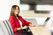 © BGStock72 - Confident businesswoman smiling during morning meeting in modern office