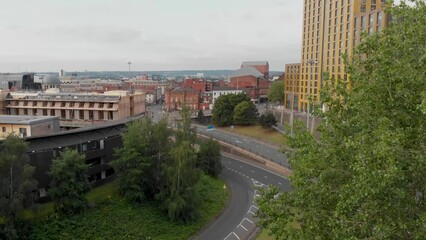 Wall Mural - Aerial footage of the Leeds City centre taken on the east side of the City Centre showing houses and businesses in West Yorkshire UK, typical British town