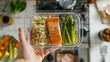 © nialyz - Balanced Meal Prep with Salmon, Asparagus, and Brown Rice in Modern Kitchen Setting Promoting Healthy Eating and Portion Control