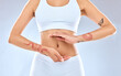 © peopleimages.com - Fitness, diet and hands with frame for slim body, self care and healthy stomach on white background studio. Wellness, exercise and abdomen of woman with workout for results, nutrition and weightloss