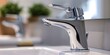 © Anastasiia - Closeup of a sleek chrome bathroom faucet for home remodeling and plumbing. Concept Bathroom Remodel, Plumbing, Chrome Fixtures, Sleek Design, Close-up Photography
