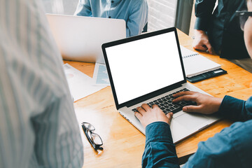 People using laptop mock-up with copyspace on screen, demonstrating technology use in an empty space