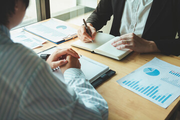 person signing an important business document, showcasing cooperation and legal consent, highlighting the significance of formal agreements and the role of paperwork in insurance and health matters.