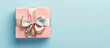 © Rai - Minimalist Father's Day banner featuring a gift box with a bow on a pastel blue background, HD quality. 32k, full ultra HD, high resolution.
