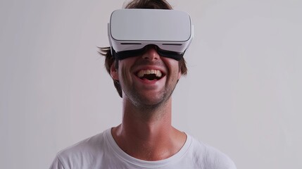 Fototapete - A man in a white t-shirt joyfully wears VR glasses against a white background, showcasing a blend of reality and virtual experience. Generative AI