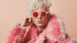 © Pavel Lysenko - A man with radiant blonde hair exudes confidence as he dons stylish pink sunglasses, emanating a bold and playful energy