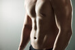 © peopleimages.com - Muscle, strong and body of man for workout, health and exercise for training goal on white studio background. Portrait, sports and bodybuilder model with sexy, young and healthy abs from fitness