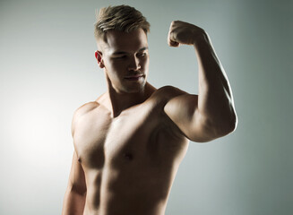 Sticker - Muscle, flexing and body of man for workout, health and exercise for training goal on white studio background. Portrait, sports and bodybuilder model with sexy, young and healthy abs from fitness