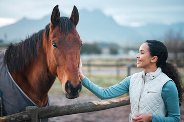 Canvas Print - Happy, girl and pet horse on farm for equestrian, training or adventure in countryside. Woman, care and stroke animal on ranch as sport jockey, rider or vet with healthy pony at fence in environment