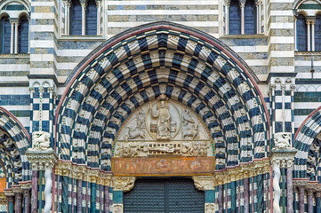 Details at facade of Genoa Cathedral or Metropolitan Cathedral of Saint Lawrence in Genoa, Italy.