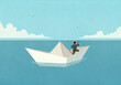 © fStop - Businessman with spyglass telescope floating on paper boat on ocean