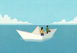© fStop - Couple floating in paper boat on ocean