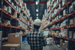 © xadartstudio - worker in warehouse, Worker Wearing Hard Hat Holding Digital Tablet Computer Walking Through Retail Warehouse full of Shelves with Goods Working in Logistics and Distribution Center