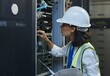 © peopleimages.com - Network engineer, data center and server room for internet infrastructure and lights of computer. Woman, IT support and cybersecurity with neon, software and company information for cloud computing