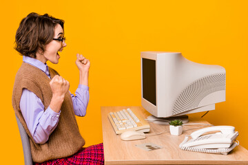 Sticker - Photo portrait of attractive young woman raise fists celebrate victory dressed retro office clothes isolated on yellow color background