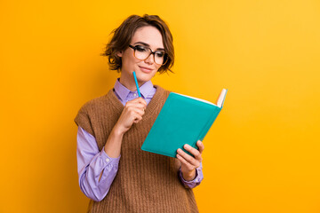 Sticker - Portrait of clever nice woman in glasses hold pencil write to do list look at book pencil on chin isolated on yellow color background