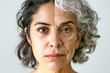 © Top AI images - Split face of young and old latin american woman showing aging concept