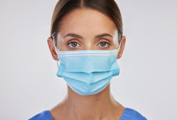 Poster - Studio, nurse and woman with thumbs up, portrait and mask for safety, yes and thank you for healthcare. White background, medical and person in mockup, professional and healthy in clinic and expert