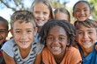 © Iigo - Portrait of happy group of children smiling at camera in the park