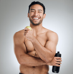 Wall Mural - Water bottle, apple and portrait of man in studio with fitness, exercise and healthy diet for nutrition. Smile, workout and shirtless athlete with h2o drink and fruit for hydration by gray background