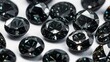 © Анастасия Макевич - group of black gemstones on white background