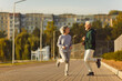 © Studio Romantic - Happy old married couple learn physical vitality and longevity secret, do sport workout, have fun. Cheerful joyful older male female friends work out, run together in park on good spring or summer day