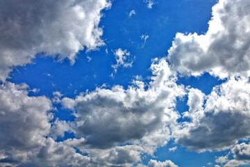 Wall Mural - Blue sky with sunlight and beautiful white clouds.